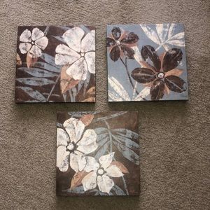 Three wall hangings with flowers